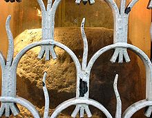 The London Stone inside its protective grille