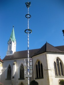 A cheerful maypole outside the church.