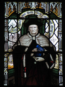 Brooke Foss Westcott, in the centre panel of the stained glass window in the north aisle of All Saints. He carries his edition of the Greek New Testament, and is flanked by George Herbert and 