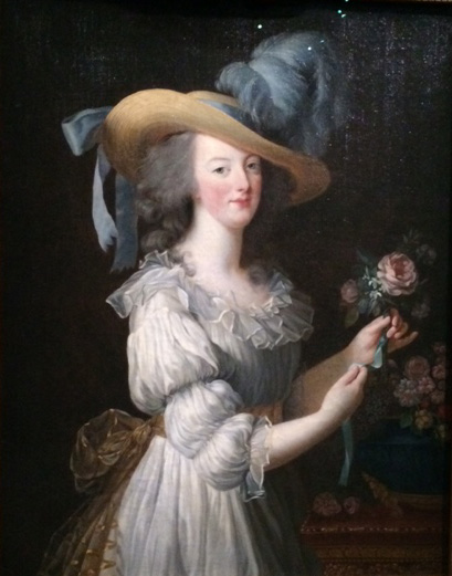 Five years later, she still holds a rose, but in an outpit and pose of scandalous informality.