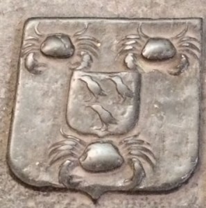 Crabs and crows on a shield.