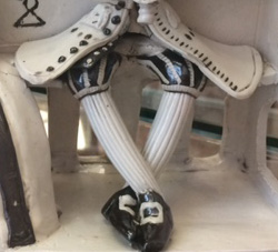 Buttons and buttonholes, breeches, stockings and shoes.