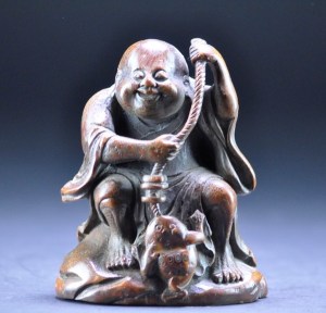 Bamboo carving of Liu Hai, with his cash-baited fishing line. (Qing Dynasty, 18th–19th century.)