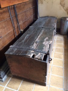 The parish chest, with three hasps for padlocks: a key was held by the priest and each of the two churchwardens, so that all three had to be present when it was opened.