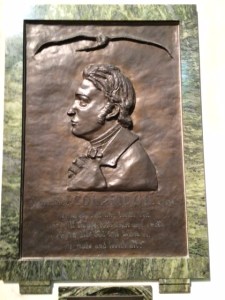 The memorial to S.T. Coleridge in Jesus College chapel. The text is from the 'Ancient Mariner': 'He prayeth best who lovest best ...'
