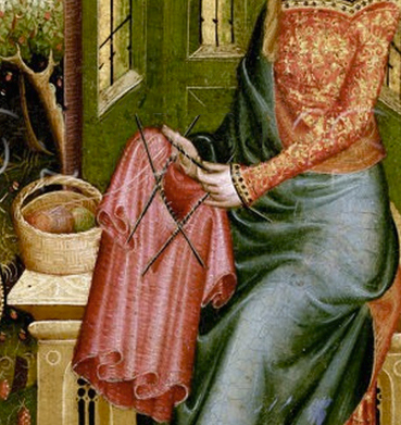 Detail of the knitted tunic, and the basket of wool.