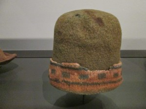 A turned-up, patterned brim: the pinkish colour may originally have been cream or white.