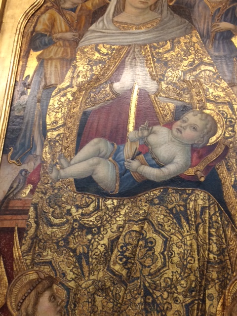 Another chunky yet flat baby, by Vittore Crivelli (late 15th century) in the Fitzwilliam Museum. Natty trousers, though, and he is holding a pink!