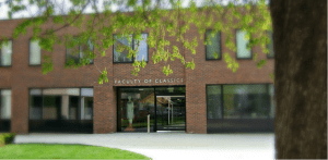 The new Faculty building, with welcoming cast in the doorway.