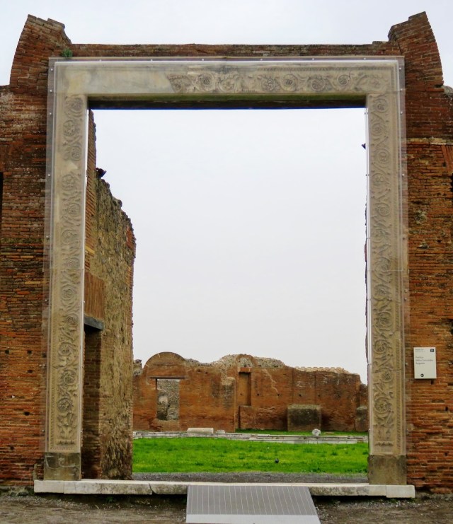The gateway of Eumachia's building, now encased on perspex. 