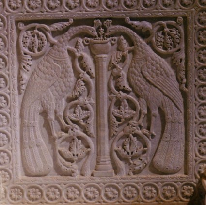 Byzantine marble panels from the cathedral of Santa Maria Assunta, Torcello: peacocks among foliage (above) and lions (below). 